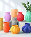 Assorted colorful 3D printed vases showcasing design versatility with Premium PETG Filament 1.75mm 2kg 3D Printer Filament Bundle.