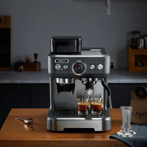 Modern espresso machine on kitchen counter with 51mm Espresso Tamper With Calibrated Spring Loaded Mechanism For Home Baristas displayed.