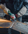 Worker using Beast Power 6 Inch 2000 Watt Brushless Angle Grinder For Industrial Use With Marathon Brushless Motor.