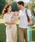 Couple with baby outdoors, holding Totally Clutch Game Changer Portable Breast Milk Cooler With 360 Degree Chill Tech.