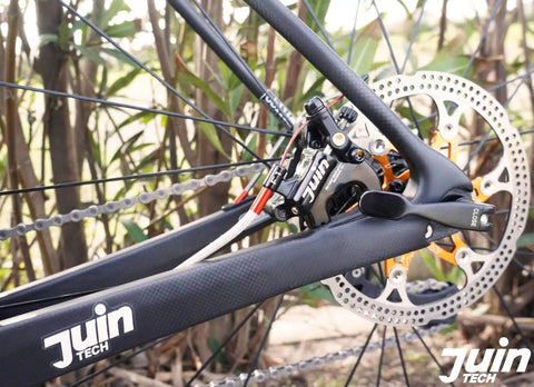 Cable Actuated Hydraulic Disc Brake Caliper Set For Flat Mount Road Gravel And CX Bikes mounted on rear wheel.
