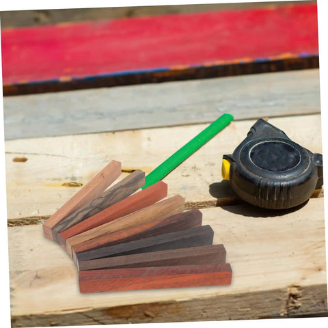 Top Shelf Wood Pen Blanks For Turning 8 Pack Exotic Lumber with varying colors on workbench with tape measure.