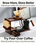 Next Level Pour Over Coffee Station And Complete Eight Piece Brewing Kit With Gooseneck Kettle Manual Ceramic Burr Grinder Large Glass Server And Solid Wood Rack, Kitchen countertop setup with brewing accessories.