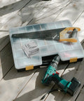 Badass Solar Panel Mounting Clips And Stainless Steel Clamps With Ultra Rugged Weatherproof Hardware For Super Solid Roof Mounts And Durable 3 Pack Installation Kit To Keep Panels Locked Down Tight Against Any Wild Weather with drilling tool and saw on work surface.