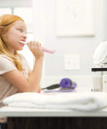 Child brushing teeth at sink with High Arc Matte Black Lavatory Faucet With 1 Or 3 Hole Install, Water Sense ADA Compliant