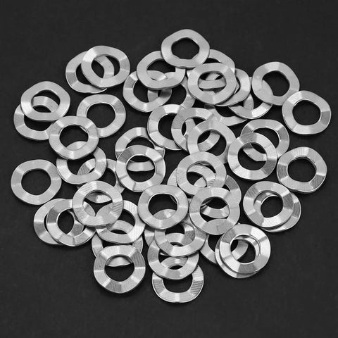 Heavy Duty Wave Spring Washers M8 50 Pack Stainless Steel Anti Loosening Hardware built tough, showing multiple washers on a dark surface.