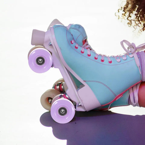 Side view of blue quad skate with 4 Pack Roller Skate Wheels With Bearings Semi Jelly Purple For Outdoor And Indoor Skates
