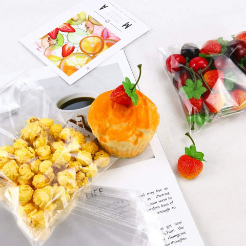 Clear Resealable 5x7 Inch Cellophane Bags 300 Pack For Bakery Candles Soap Cookies Durable Food Safe Poly Bags Ideal For Gift Packaging And Keeping Treats Fresh with popcorn and fruits