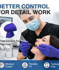 Rock Solid Dark Blue Nitrile Exam Gloves 100 Pack Powder Free And Latex Free Medical Grade Disposable Gear in use by dentist.