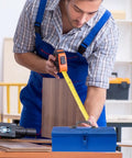 Blue Iron Toolbox With Heavy Duty Lock And Steel Reinforced Corners Comfortable Grip Bar For Hardware Bits Sorting on a workbench.