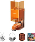 Front view of xTool F2 orange laser engraver with built-in camera; pendant, headphones, wooden stamp, pop-art print.