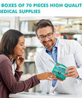 Front view of a pharmacist presenting a teal General Medi 420-piece first aid kit set (6 boxes of 70 items).