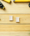 Plastic Caster Socket Inserts 10-Pack, Swivel Caster Stem Sleeves For Office Chair Feet, Light Yellow, on wooden surface