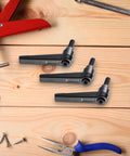 Three Piece Zinc Alloy Clamping Lever Thumb Ratchet For Trailer Jack Handle Ratcheting Wrench on wooden surface