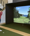 Person using Indoor Golf Simulator Enclosure Kit 10 X 8 Ft With 4K Ready Dual Layer Projection Screen and safety netting indoors