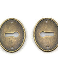 Top Tier 10 Pack Zinc Alloy Oval Keyhole Escutcheons Heavy Duty Antique Bronze Lock Covers showing two plates with keyholes.