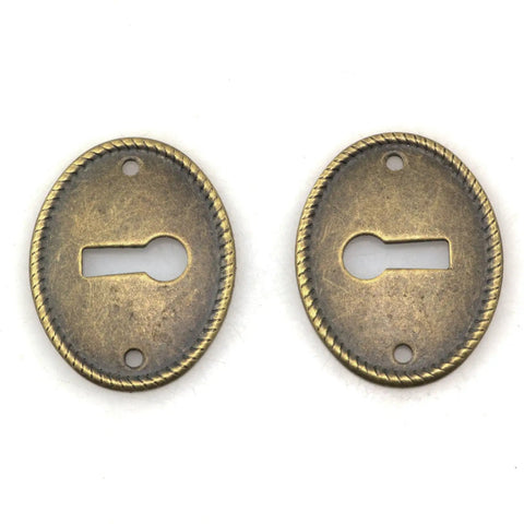 Top Tier 10 Pack Zinc Alloy Oval Keyhole Escutcheons Heavy Duty Antique Bronze Lock Covers showing two plates with keyholes.