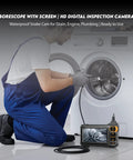 Handheld Borescope Camera With Built-In 4.3 Inch Display, 1080P Snake Camera, 16.5 Ft Cable, 8 LEDs, IP67 Waterproof, 1800mAh Battery, No Phone Needed, Perfect For Automotive, Plumbing, HVAC, And Wall Inspections. Technician inspecting washing machine drum