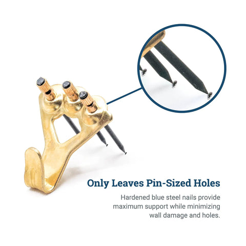 100 Lb Picture Hanging Hooks Set with nails showing pin-sized wall holes, perfect for drywall and plaster.