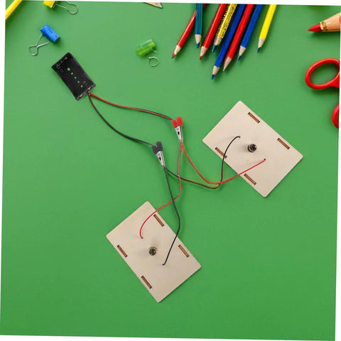 Hands On Stem Circuit Experiment Kit For Interactive Science Projects With Series And Parallel Circuits on green background.