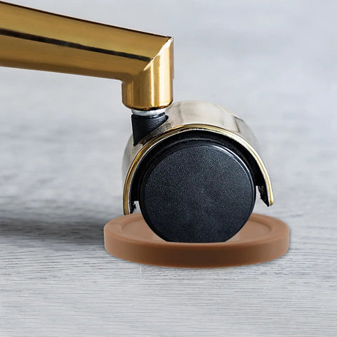 Furniture wheel on a brown plastic caster cup, showing the deep U shape, part of the Brown Couch Stoppers Four Pack Stop Slipping For Sofas Beds Chairs And More Durable Plastic Caster Cups Fit Most Furniture Wheels Under One And A Half Inches With Deep U Shape To Keep Your Furniture In Place.