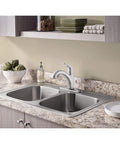 Colony Pro Pull Out Kitchen Faucet with Dope Sprayer and Ceramic Disc Valve in polished chrome installed on marble countertop