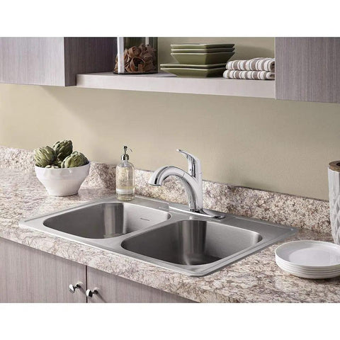 Colony Pro Pull Out Kitchen Faucet with Dope Sprayer and Ceramic Disc Valve in polished chrome installed on marble countertop