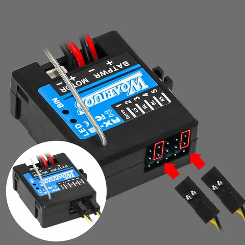 Close-up of 2 In 1 ESC and Receiver Combo with 2.4G Transmitter for Axial SCX24 RC Car, showing connectors and integrated car light.