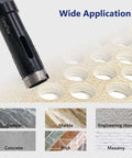 Diamond core drill bit, 1-inch (25mm), laser-welded diamond, side view near drilled holes in stone surface