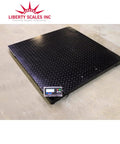 Heavy Workhorse Industrial Floor Scale For High Volume Warehouses With Sturdy 48 By 48 Inch Platform and digital readout on black steel deck.