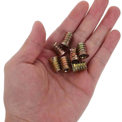 Must Have 4-20x15mm Threaded Inserts For Wood Furniture Assembly Kit Plus Furniture Repair Screw In Nuts And Hardware With Precision Crafted Uniform Size Threads Making DIY Projects A Total Snap And Easy Fix Anytime hand holding 4-20x15mm threaded inserts