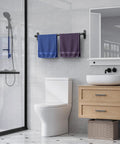 Matte Black 24 Inch Wall Mounted Towel Rack With Rustproof Aluminum Construction in a modern bathroom setting with towels