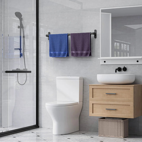 Matte Black 24 Inch Wall Mounted Towel Rack With Rustproof Aluminum Construction in a modern bathroom setting with towels