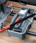 Universal Bore Guide With Three Muzzle Guides on cleaning station tray for firearms maintenance