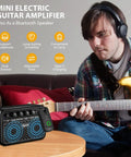 Man playing electric guitar with Mini Guitar Amp 5W Portable Practice Amplifier, Bluetooth, and dual channel features visible.