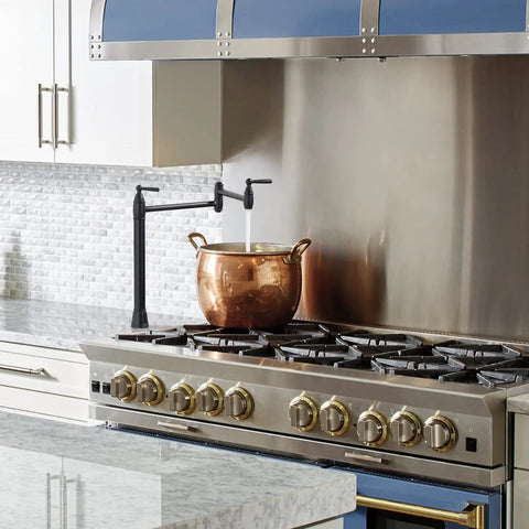 Deck Mounted Pot Filler Faucet In Brushed Gold With Folding Double Joint Swing Arms above a stove, adding kitchen convenience