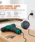 8V Cordless Drill Set With USB Rechargeable Driver connected to power outlet, showing charging LEDs, drill bits on table in home setting.