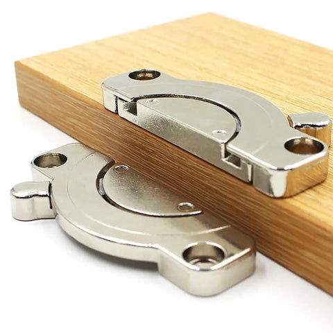 Say Bye To The Wiggle Heavy Duty Zinc Alloy Table Top Connectors With Secure Latch on wooden panel close-up.