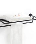 Chrome Wall Mounted Towel Rack For Bathroom Modern Hotel Style Towel Bar Shelf Single Towel Holder 26 Inch Durable Brass Construction Leo Series Collection with folded towels on top.
