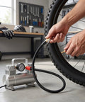 Heavy Duty Tire Inflator Extension Hose With Quick Connect Air Chuck Fits Car Motorcycle And Bike Easy Reach For Recessed Valves 16cm External Thread For Seamless Pump Up Jobs On Road Or Home Get Your Ride Road Ready Snappy Quick Fixes Done Now. Black braided hose connected to bike tire valve and air compressor in garage