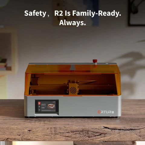 10W Enclosed Laser Engraver And Cutter With Smart Camera Positioning, batch engraving device on a wooden table, orange cover