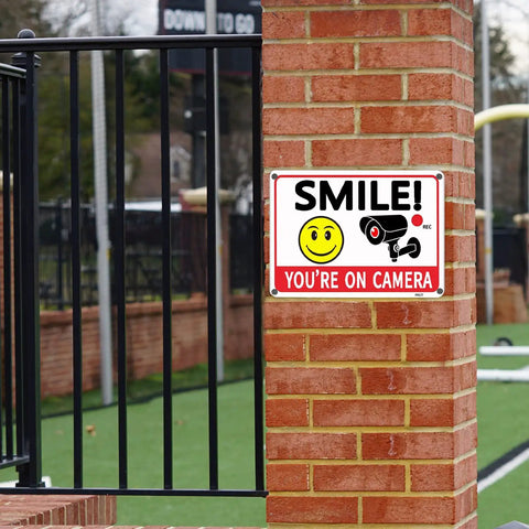 Legit Heavy Duty Aluminum Security Camera Signs Straight Up Warning To Scare Off Thieves Keep Your Home Yard Or Business Locked Down Bright Orange Black Cctv 4 Pack on brick fence.