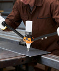 Person using Two-Handed Pop Rivet Gun Kit With 230 Blind Rivets, 5 Interchangeable Nosepieces for fastening metal sheet in workshop