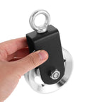Beefed Up Heavy Duty Pulley Set For Home Gym Cable System With Aluminum Alloy Wheel, Strap And Carabiner, Smooth Bearing Design For DIY Strength Training And Replacement Pulleys, black pulley shown with metal eyelet and wheel