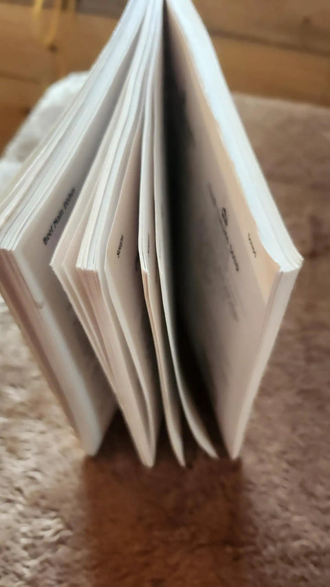 Close-up of The Award Winning Healthy Low Fat Slow Cooker Cookbook For Quick Easy Family Dinners showing pages of recipes.