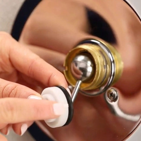 Close-up of 11 Piece Delta Faucet Repair Kit with 212 SS ball installation for leak-free single handle faucets.
