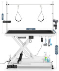 Heavy Duty Electric Dog Grooming Table With Smooth Operator Foot Pedal And Kickass Sturdy X Frame For Easy Height Adjustments And No Sweat Pet Styling In White, showing dimensions and grooming accessories.