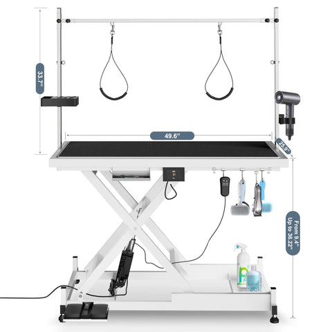 Heavy Duty Electric Dog Grooming Table With Smooth Operator Foot Pedal And Kickass Sturdy X Frame For Easy Height Adjustments And No Sweat Pet Styling In White, showing dimensions and grooming accessories.