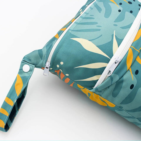 Close-up of zippered pocket on green leaf design Two Pack Waterproof Wet Bags With Two Zippered Pockets Reusable Travel Beach Pool Diaper Organizer