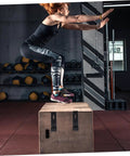 Athlete jumping on a box in a gym; visible Two Pack Rubber Over Center Latch For Electrical Cabinets Flexible Draw Lock With Concealed Keeper